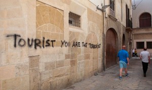 spain-tourism-sign-tourist-are-the-terrorist-705870